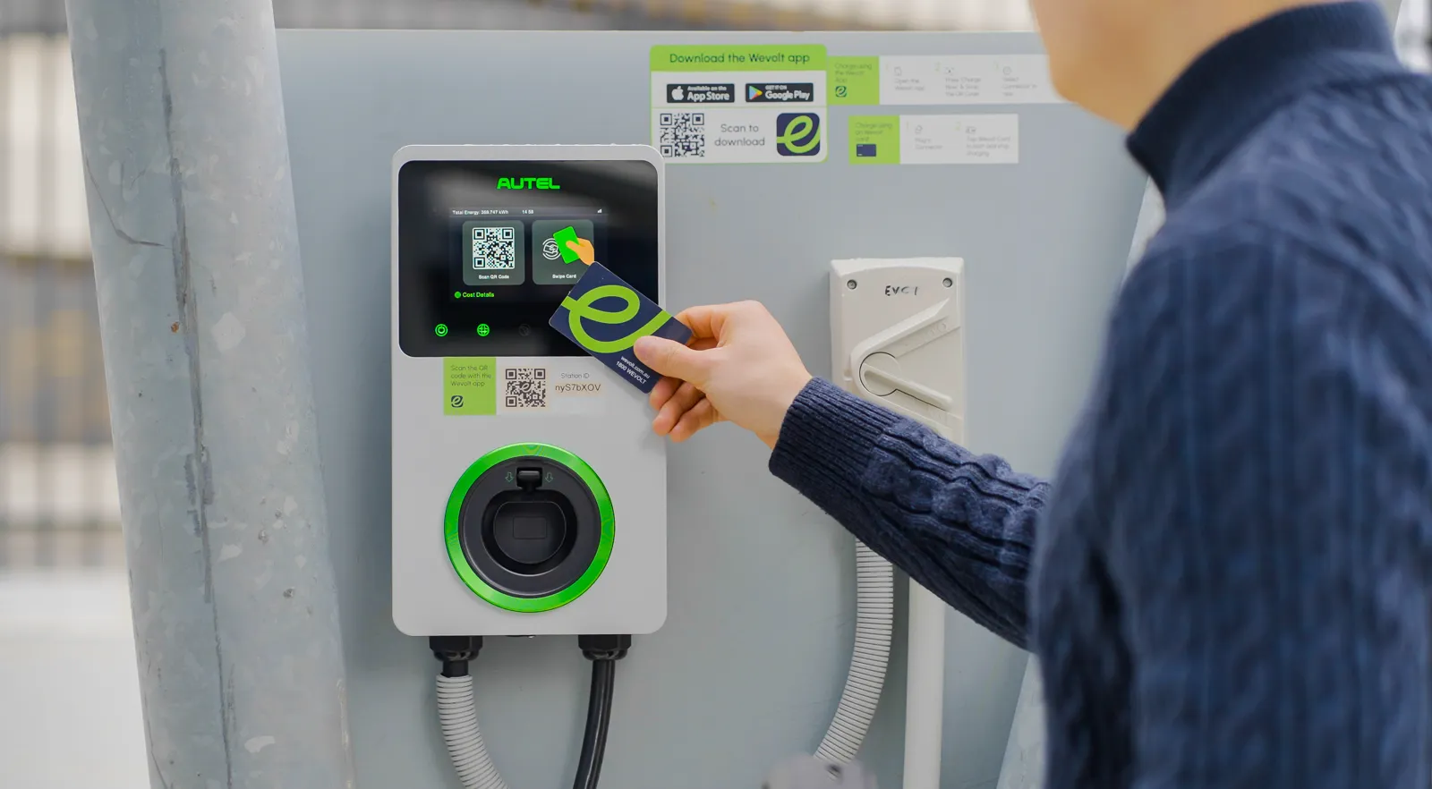 A driver tapping a Wevolt RFID card on a charge point