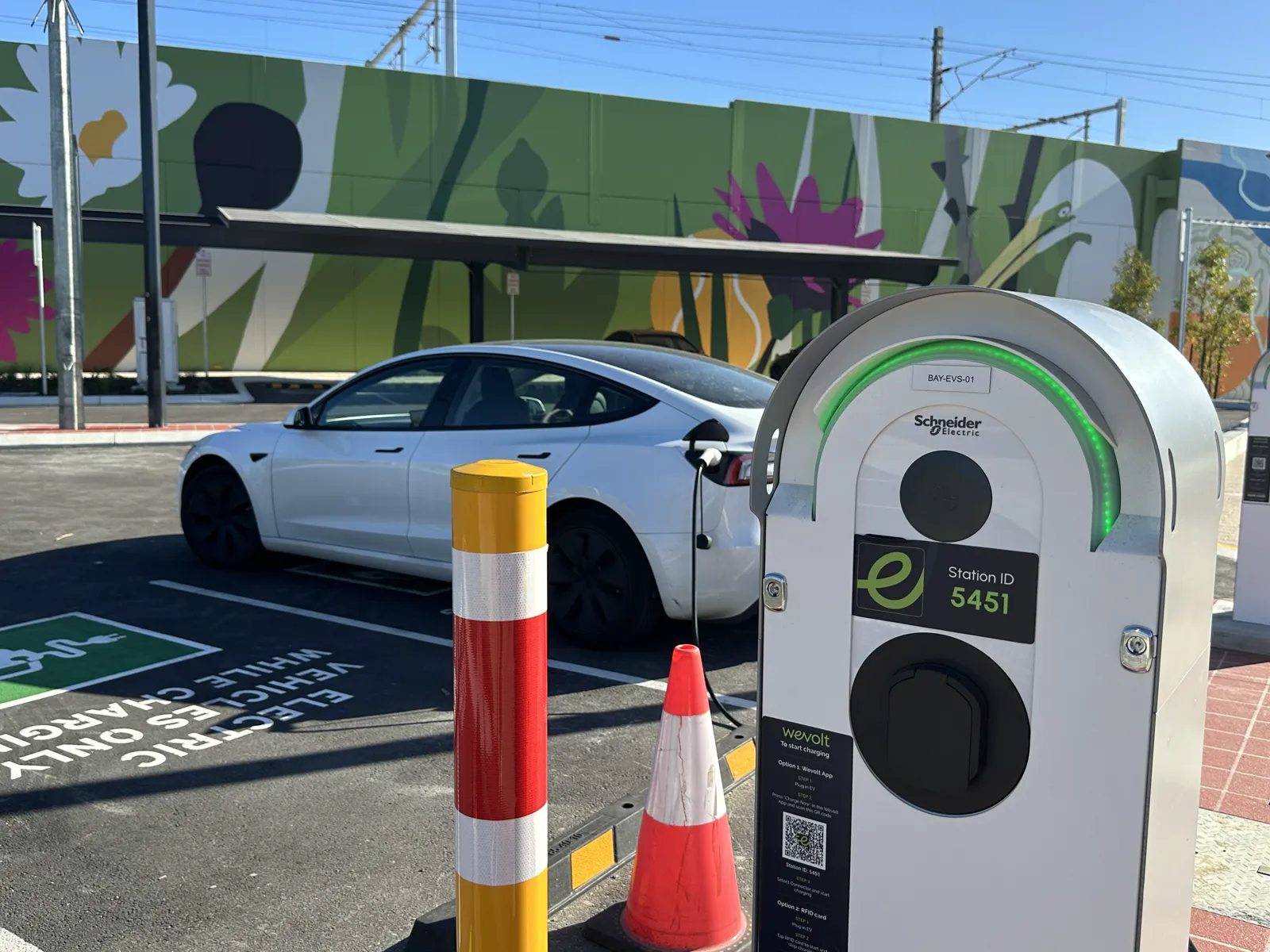 An EV charging beside a Wevolt charge point at Bayswater train station